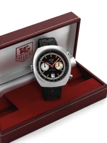 HEUER MONTREAL REF. 110.503 BLACK DIAL.Heuer, Montreal, Automatic, Chronograph, Ref. 110.503B..Made circa 1974..Fine, tonneau-shaped, water resistant, self-winding, stainless.steel wristwatch with round button chronograph, registers.date, tachometer and p