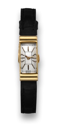 PATEK PHILIPPE REF. 1043 YELLOW GOLD.Patek Philippe & Co., Geneve, movement No. 840826, case.No. 505961, Ref. 1043. Made in 1938, sold on October.1st,1938..Fine, rectangular, 18K yellow gold lady