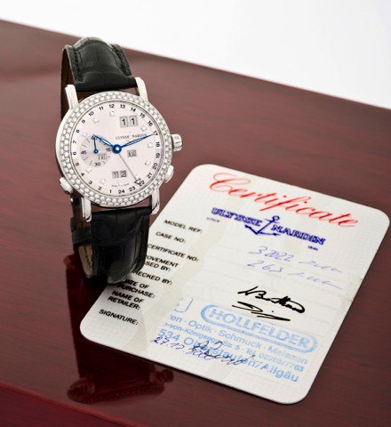 ULYSSE NARDIN REF. 320-22 WHITE GOLD AND.DIAMOND PERPETUAL CALENDAR - GMT.Ulysse Nardin, Locle & Genève, Perpetual Calendar – GMT,.No. 263, Ref. 320-22. Sold on December 27th, 2000..Very fine, self-winding, water-resistant, two time zone, 18K.white gold w