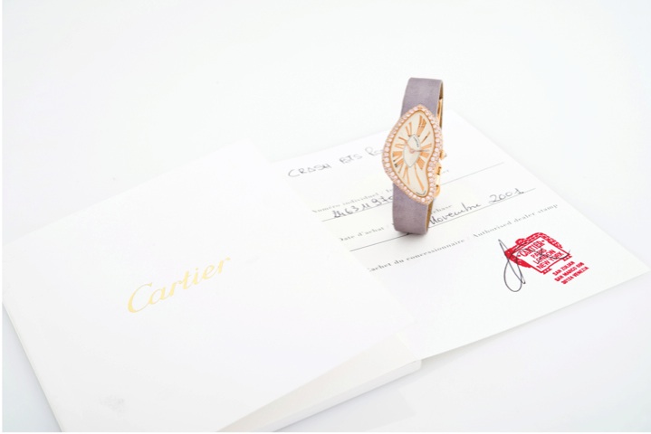 CARTIER CRASH DIAMONDS AND PINK GOLD.Cartier, Crash, case No.119703AF, Ref. 2463, sold in.November 2001..Very fine and rare, 18k pink gold, asymmetrical.wristwatch with an 18k pink gold Cartier deployant.clasp. Accompanied by fitted box and Certificate.