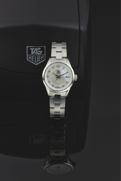 TAG HEUER REF. WV1411.CARRERA QUARTZ STEEL & DIAMOND.Tag Heuer, Swiss, Carrera, No. EEH1908, Ref. WV 5111..Made circa 2005..Fine, center seconds, water-resistant, stainless steel.and diamonds quartz wristwatch with date and a Tag.Heuer stainles