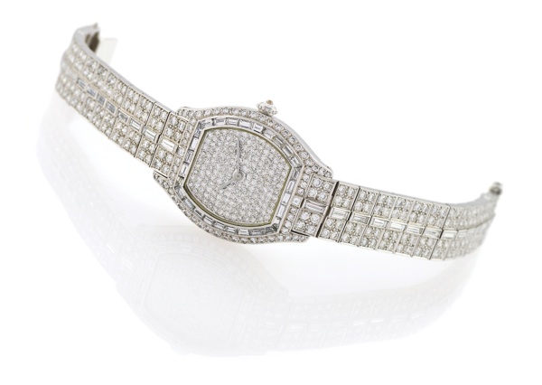CARTIER HAUTE JOAILLERIE – PLATINUM & DIAMOND TORTUE.Cartier, ‘Collection Rivière’, No. A 101374, Ref. 895 292 BB, the.movement by Vacheron & Constantin, No. 648501. Made in.1986..Very fine and extremely elegant, tonneau-shaped, platinum.and di