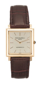 PATEK PHI LIPPE. REF.3490 YELLOW GOLD. Patek Philippe, Retailed by Hausmann & co, No.1130681. case No. 2633581, Ref. 3490. Made in the 1960s.. Fine, flat, square, 18K yellow gold wristwatch.
