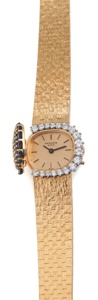 Patek Philippe Ref. 4105/1 DIAMOND SAPPHIRE & YELLOW. GOLD. Patek Philippe, Geneve, No. 1247310, case No. 2682084. Ref. 4105/1. Made in the early 1970’s.. Very fine and elegant, horizontal oval, 18K yellow gold, diamond and. sapphire lady’s wristwatch wit