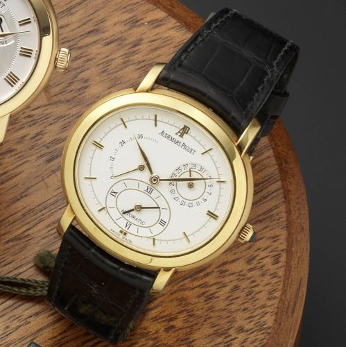 Audemars Piguet. An 18ct gold automatic dual time wristwatch