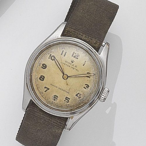 Rolex. A stainless steel manual wind wristwatch