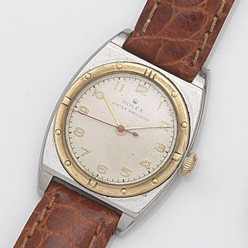 Rolex. A stainless steel and gilt manual wind wristwatch