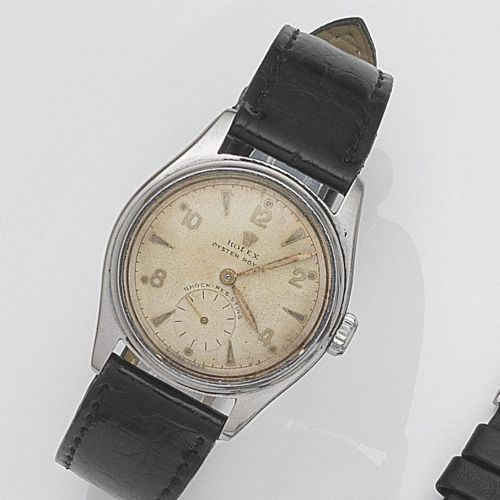 Rolex. A stainless steel manual wind wristwatch