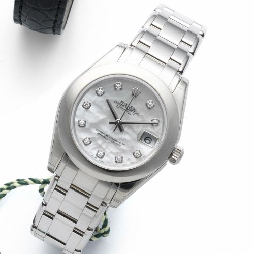 Rolex. A mid-size 18ct white gold and diamond set automatic calendar bracelet watch