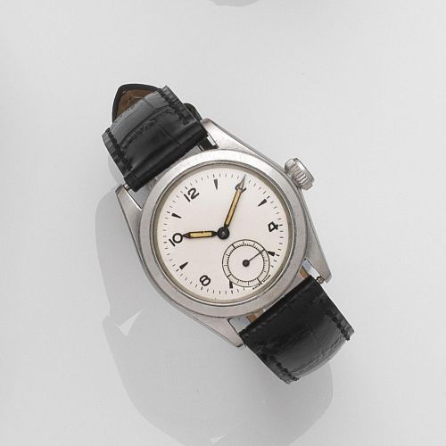 Rolex. A stainless steel manual wind wristwatch