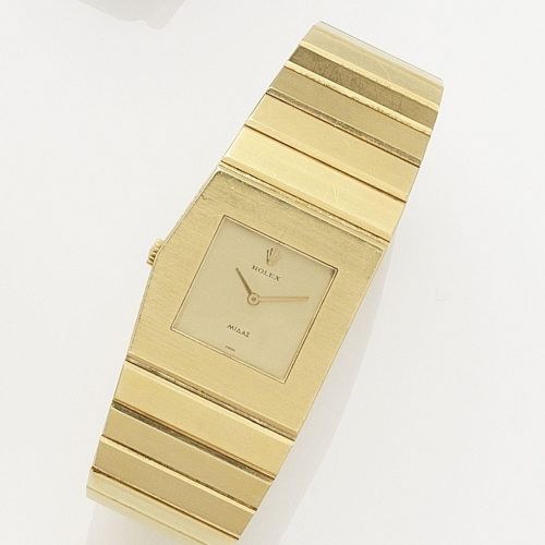 Rolex. An 18K gold manual wind left handed bracelet watch