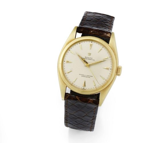 Rolex. An 18K gold automatic wristwatch
