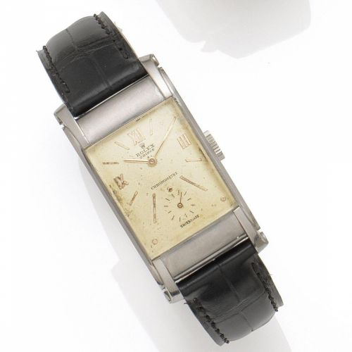 Rolex. A stainless steel manual wind wristwatch