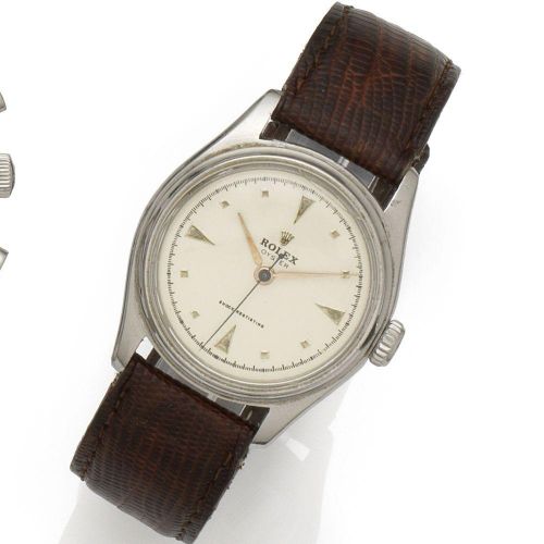 Rolex. A stainless steel manual wind wristwatch