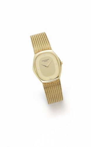 Patek Philippe. An 18K gold and diamond set manual wind bracelet watch