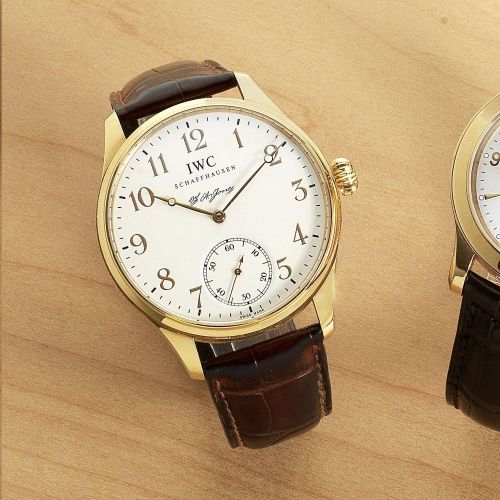 IWC. An 18K gold manual wind wristwatch