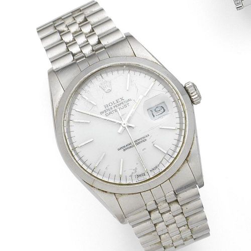 Rolex. A stainless steel automatic calendar tonneau form bracelet watch