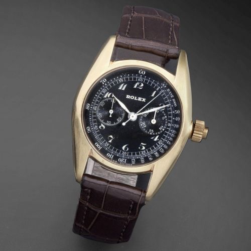Rolex. A rare and unusual 18K gold manual wind single button chronograph wristwatch