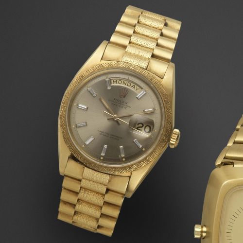 Rolex. An 18K gold and diamond set automatic calendar bracelet watch