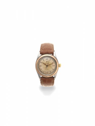 Rolex. A stainless steel and gold manual wind wristwatch