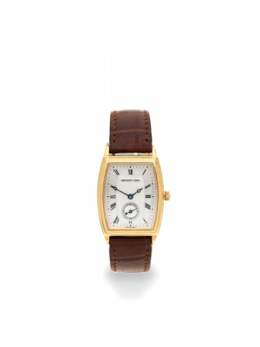 Breguet. A lady's 18K gold automatic tonneau form wristwatch