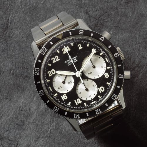 Breitling. An unusual stainless steel manual wind chronograph wristwatch with 24 hour dial
