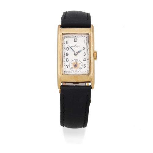 Rolex. A 9K gold manual wind wristwatch