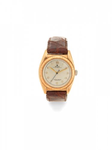 Rolex. A 14K gold automatic bubbleback wristwatch