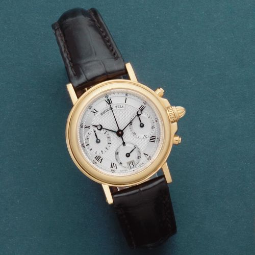 Breguet. An 18K gold automatic calendar chronograph wristwatch