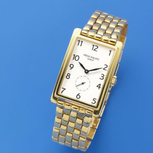 Patek Philippe. An 18K gold manual wind rectangular bracelet watch