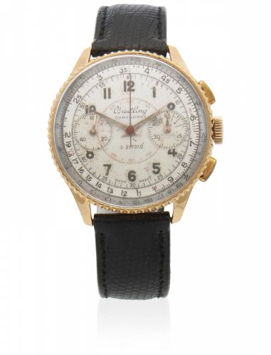 Breitling. An 18K gold manual wind chronograph wristwatch