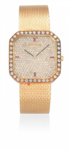 Patek Philippe. An 18K gold and later diamond set manual wind cushion form bracelet watch