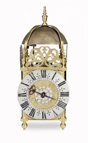 A fine late 17th century brass lantern clock previously with centrally mounted verge escapement