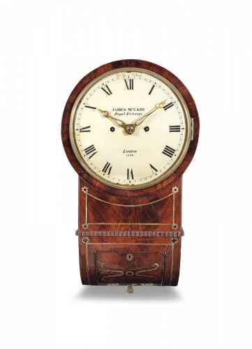 A first half of the 19th century brass-inlaid mahogany striking wall clock