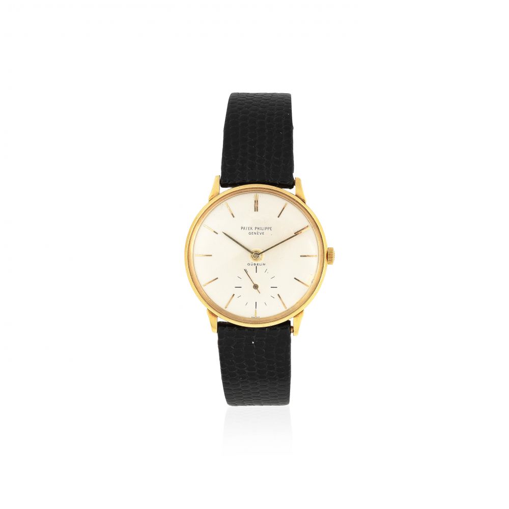 Patek Philippe. An 18K gold manual wind wristwatch retailed by Gübelin