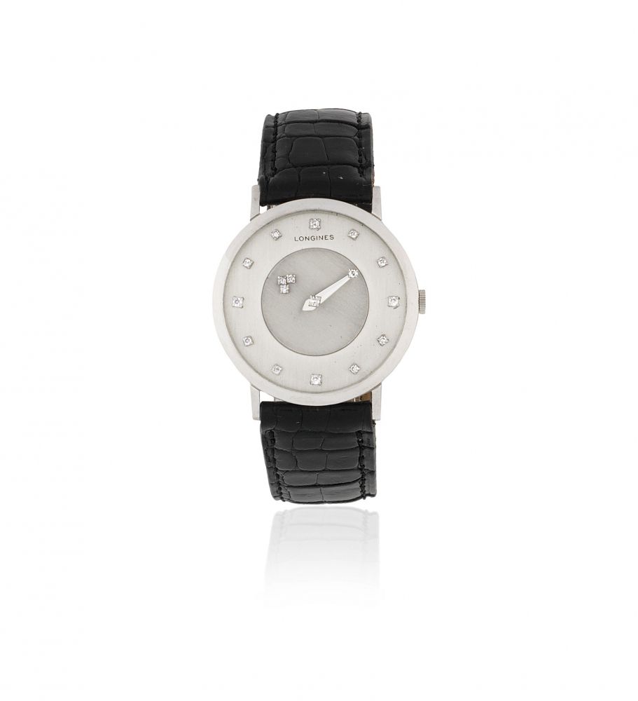 Longines. A 14K white gold manual wind mystery wristwatch