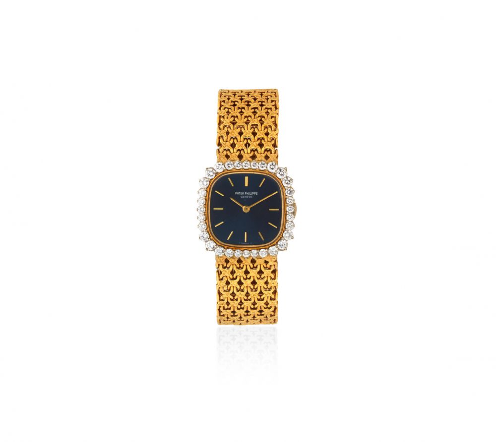 Patek Philippe. An 18K gold and diamond set manual wind square bracelet watch