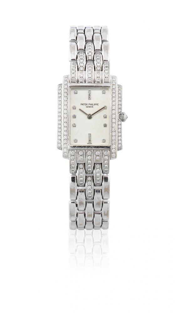 Patek Philippe. A lady's 18K white gold and diamond set quartz rectangular bracelet watch