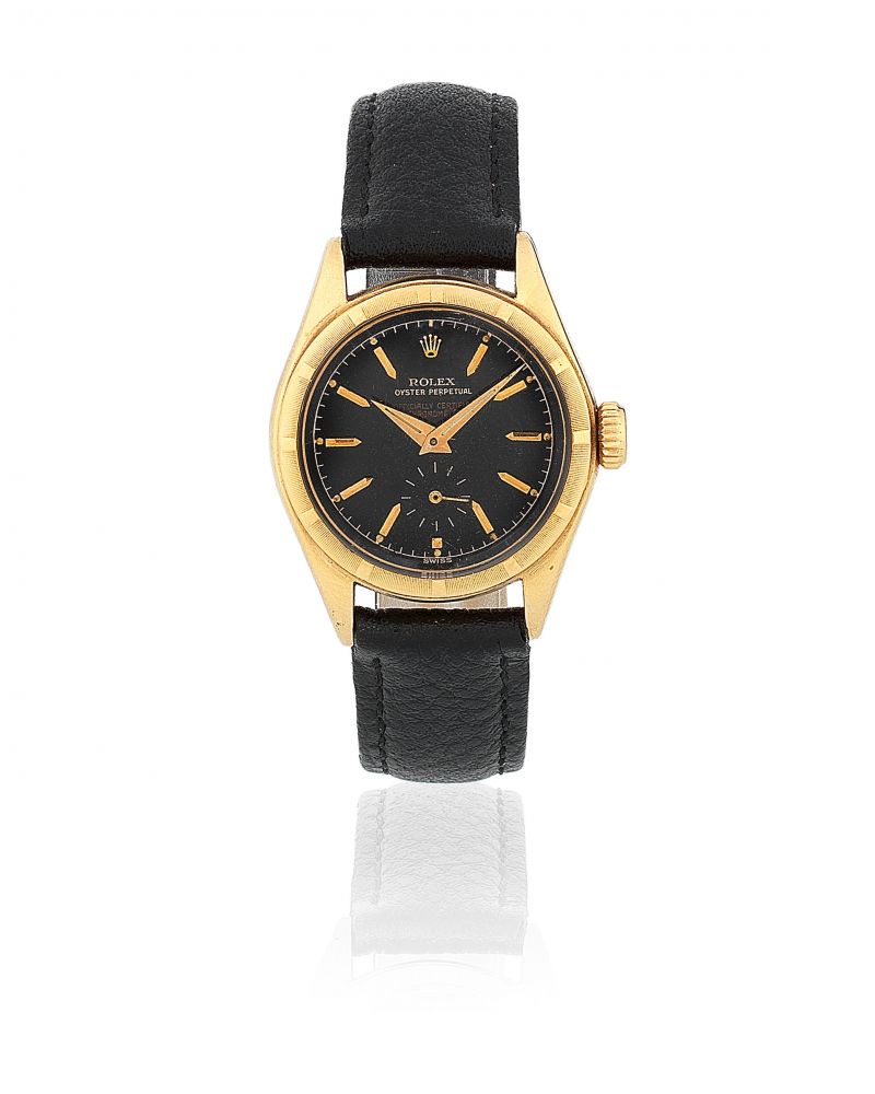 Rolex. A mid-size 18K gold automatic bubbleback wristwatch