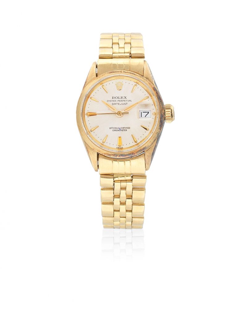 Rolex. A lady's 18K gold automatic calendar bracelet watch