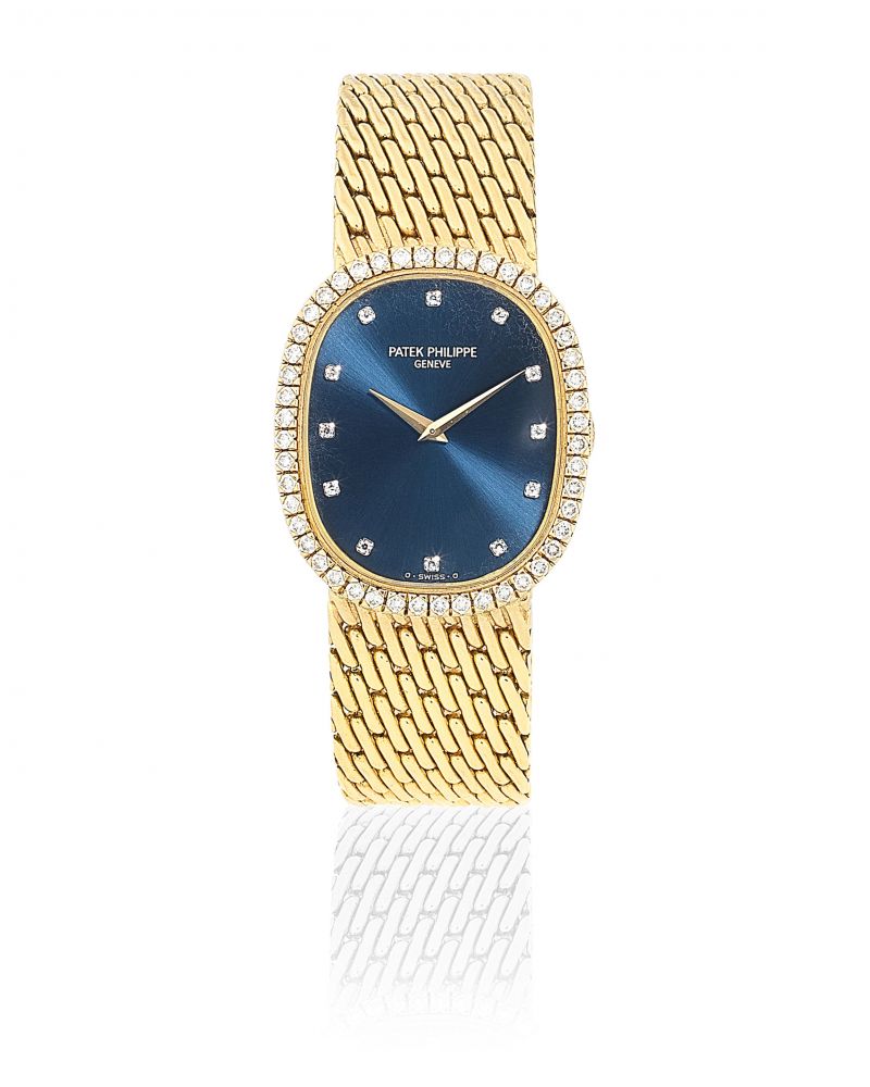 Patek Philippe. An 18K gold and diamond set manual wind oval bracelet watch