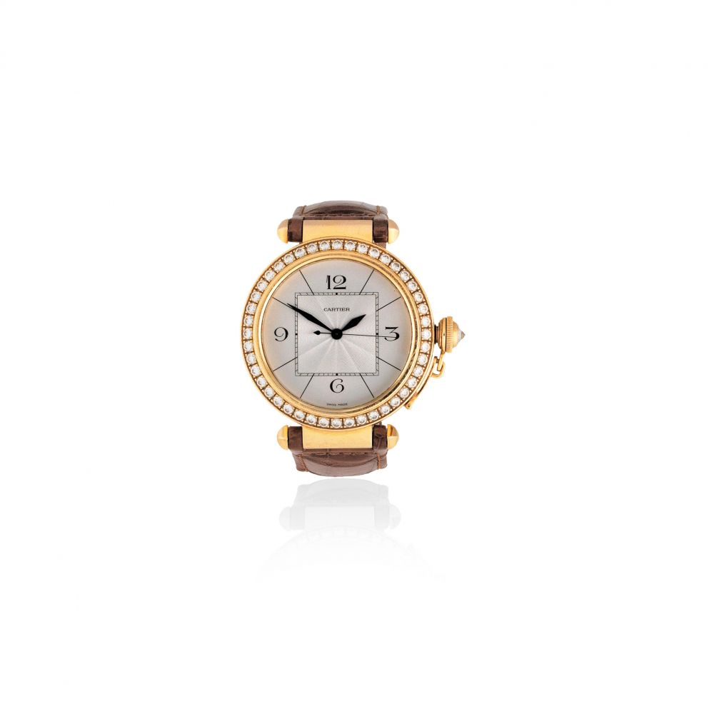Cartier. An 18K gold and diamond set automatic wristwatch
