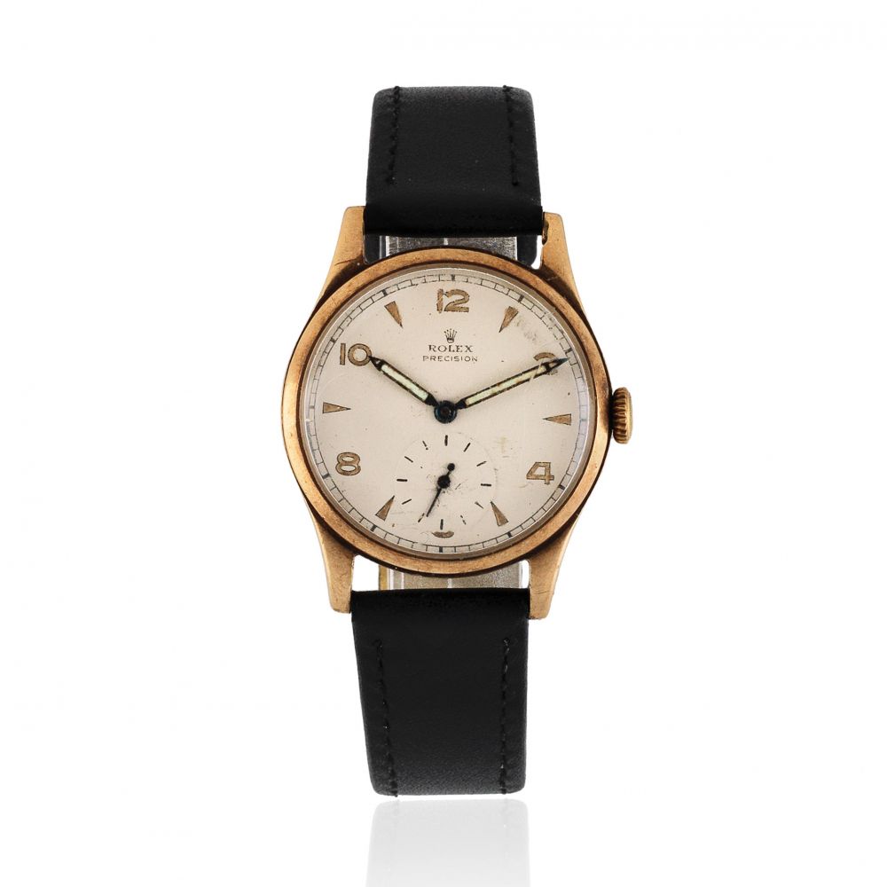 Rolex. A 9K gold manual wind wristwatch