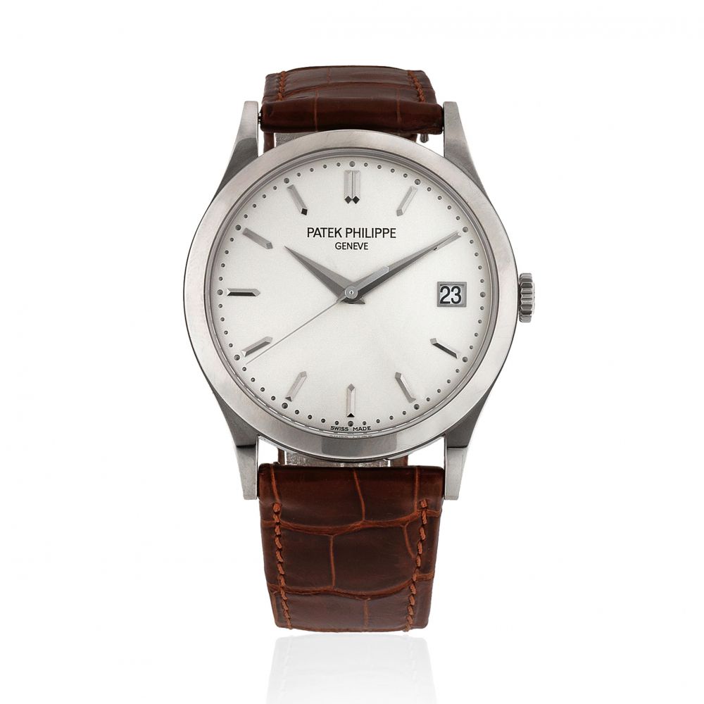 Patek Philippe. An 18K white gold automatic calendar wristwatch