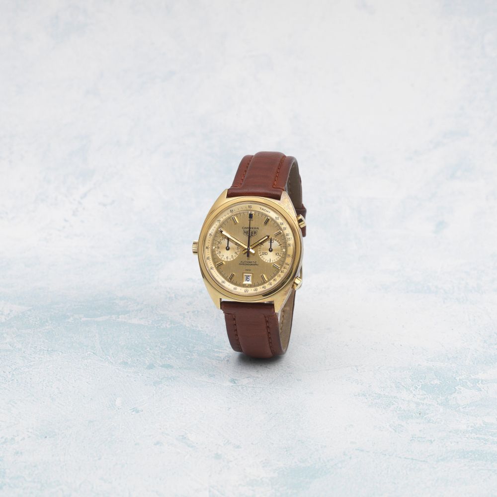 Heuer. An 18K gold automatic calendar chronograph wristwatch