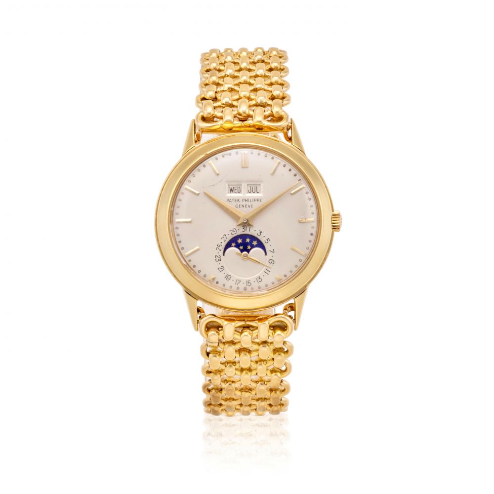 PATEK PHILIPPE. AN EXCEPTIONAL AND RARE 18K GOLD PERPETUAL CALENDAR BRACELET WATCH WITH MOON PHASE
