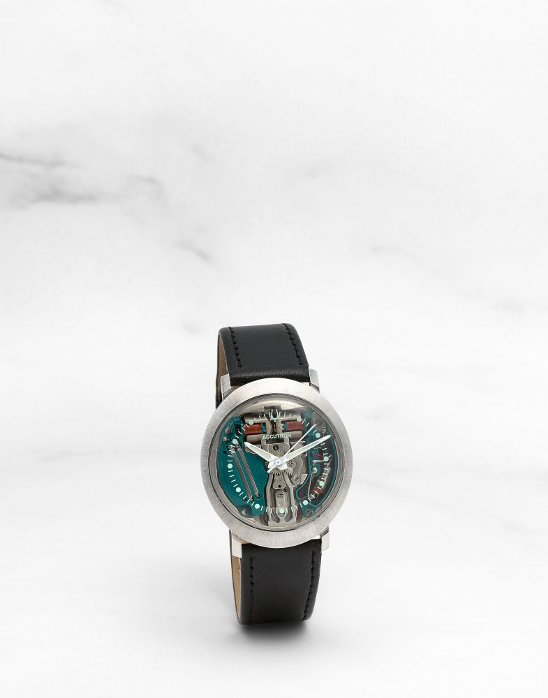 BULOVA. MONTRE BRACELET EN ACIER AVEC CADRAN SQUELETTE MOUVEMENT ELECTRONIQUE