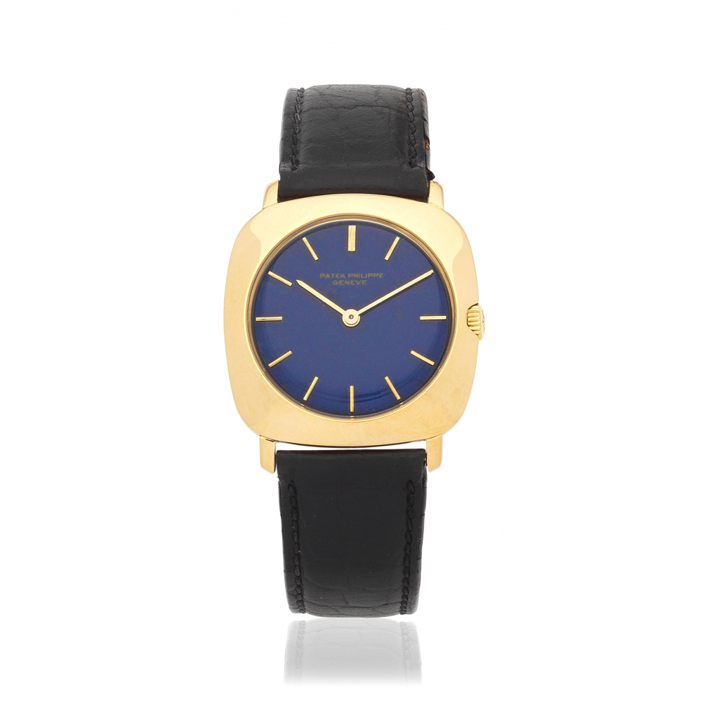 Patek Philippe. An 18K gold manual wind cushion form wristwatch