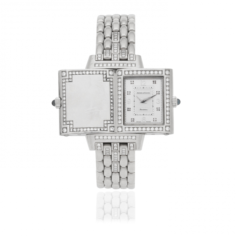 Jaeger-LeCoultre. A lady's 18K white gold diamond set quartz reversible bracelet watch