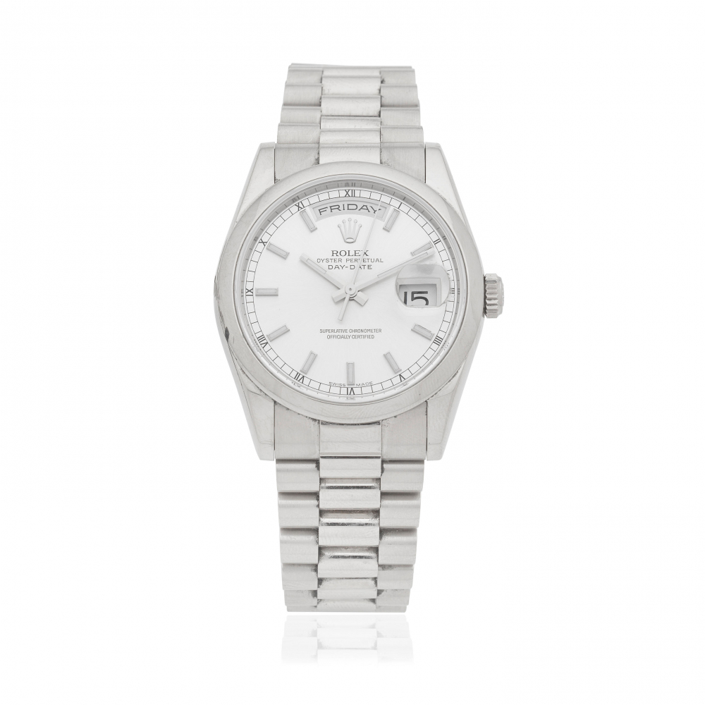Rolex. An 18K white gold automatic calendar bracelet watch formerly the property of Sir Peter Hall, Director of the National Theatre from 1973 to 1988